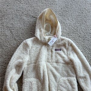 Super soft fuzzy jacket in a children’s XL. Never worn.